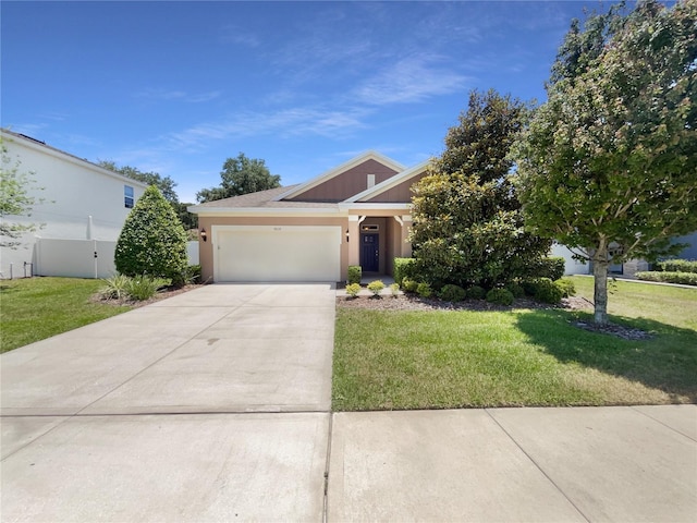 4010 Brookshire Cir, Eustis, FL 32736 - view of front of home featuring a garage, driveway, and stucco siding