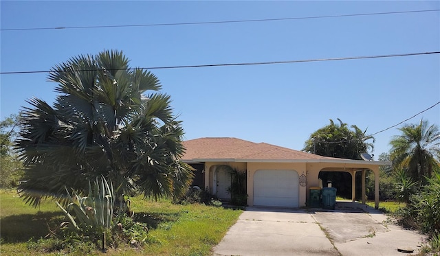 155 Summerset Dr, Punta Gorda, FL 33982 - view of front of property featuring concrete driveway, an attached garage, and stucco siding