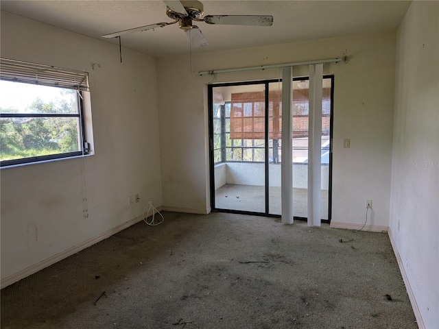 155 Summerset Dr, Punta Gorda, FL 33982 - carpeted empty room with plenty of natural light, baseboards, and a ceiling fan