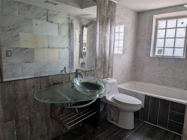 155 Summerset Dr, Punta Gorda, FL 33982 - bathroom featuring a tub, toilet, vanity, and tile walls