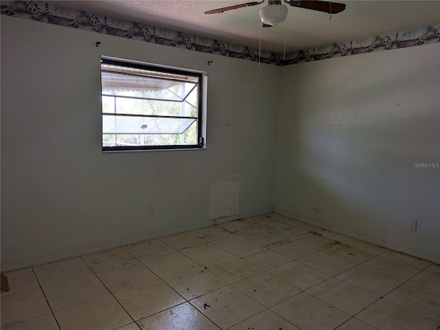 155 Summerset Dr, Punta Gorda, FL 33982 - unfurnished room with a textured ceiling, a ceiling fan, and baseboards