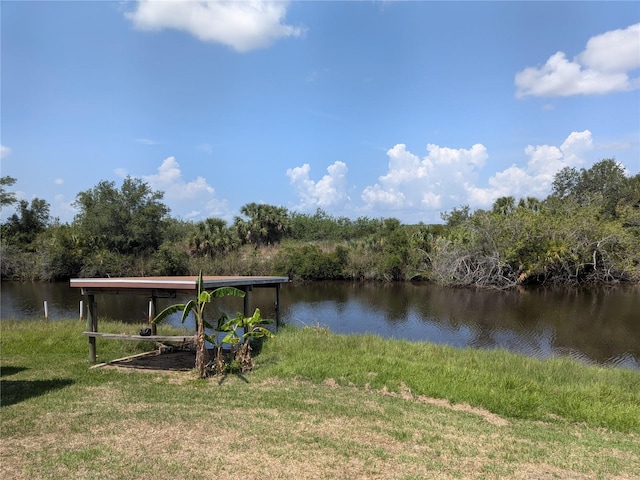 155 Summerset Dr, Punta Gorda, FL 33982 - dock area with a water view and a lawn