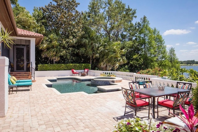 9724 Chestnut Ridge Dr, Windermere, FL 34786 - view of swimming pool featuring a patio area, outdoor dining area, and a pool with connected hot tub