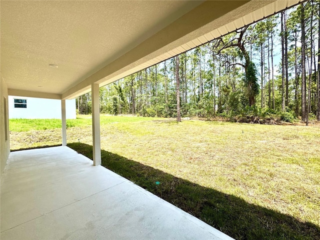 1795 W Linden Dr, Citrus Springs, FL 34434 - view of green lawn featuring a patio area