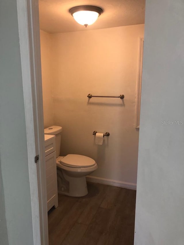 647 Madison Ave, Daytona Beach, FL 32114 - bathroom featuring wood finished floors and toilet
