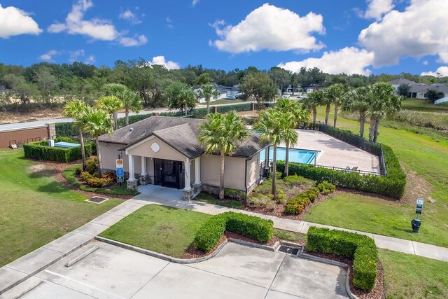 316 Primrose Dr, Davenport, FL 33837 - view of front of house featuring uncovered parking and stucco siding