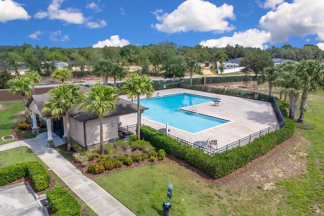 316 Primrose Dr, Davenport, FL 33837 - community pool with a patio
