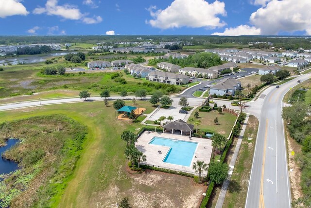 316 Primrose Dr, Davenport, FL 33837 - aerial perspective of suburban area with a nearby body of water and a pool area