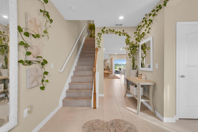 316 Primrose Dr, Davenport, FL 33837 - stairway featuring baseboards, tile patterned floors, and recessed lighting