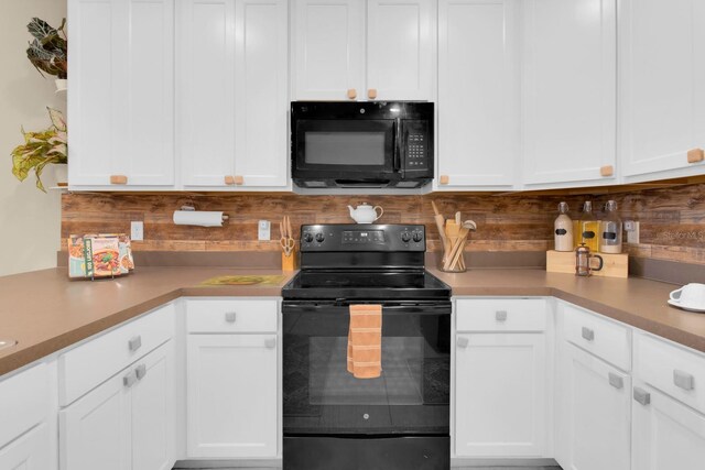 316 Primrose Dr, Davenport, FL 33837 - kitchen featuring black appliances, decorative backsplash, white cabinets, and light countertops