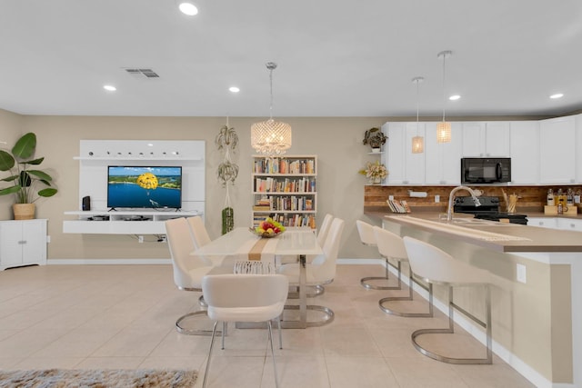 316 Primrose Dr, Davenport, FL 33837 - dining area featuring recessed lighting, light tile patterned flooring, and baseboards