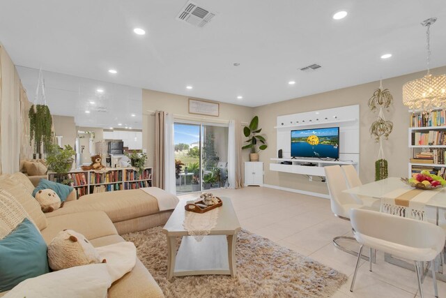 316 Primrose Dr, Davenport, FL 33837 - living room featuring light tile patterned floors, a chandelier, and recessed lighting