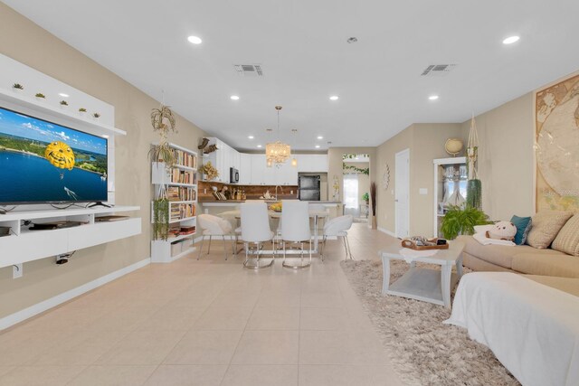 316 Primrose Dr, Davenport, FL 33837 - living area with light tile patterned flooring, recessed lighting, and baseboards