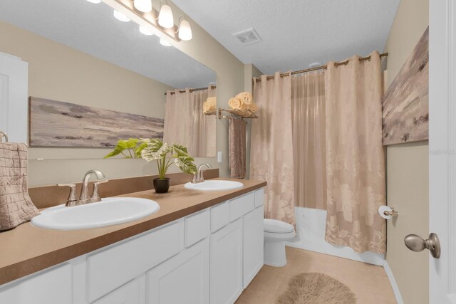 316 Primrose Dr, Davenport, FL 33837 - full bathroom with tile patterned floors, toilet, double vanity, and shower / tub combo