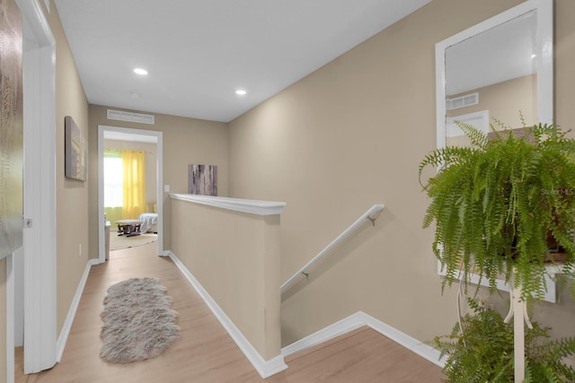316 Primrose Dr, Davenport, FL 33837 - corridor featuring an upstairs landing, wood finished floors, baseboards, and recessed lighting