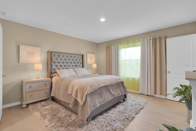 316 Primrose Dr, Davenport, FL 33837 - bedroom with light wood finished floors, recessed lighting, and baseboards