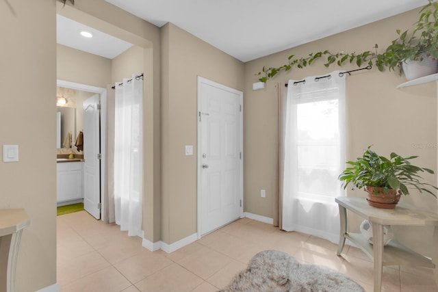 316 Primrose Dr, Davenport, FL 33837 - entrance foyer featuring light tile patterned flooring and baseboards