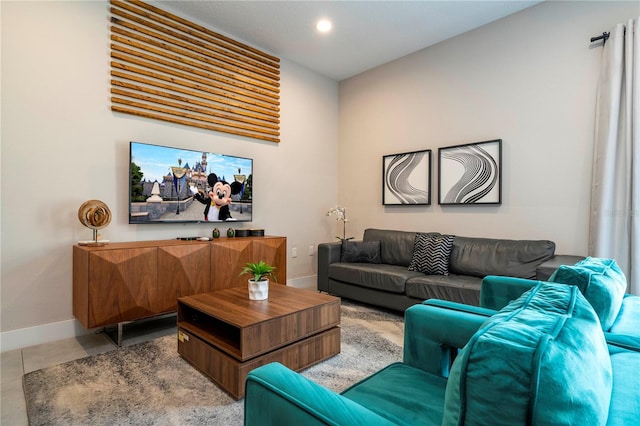 living room with baseboards, recessed lighting, and light tile patterned flooring