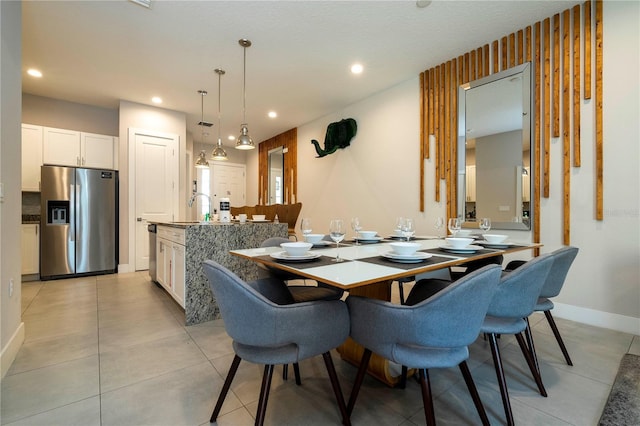 dining space with baseboards, recessed lighting, and light tile patterned flooring