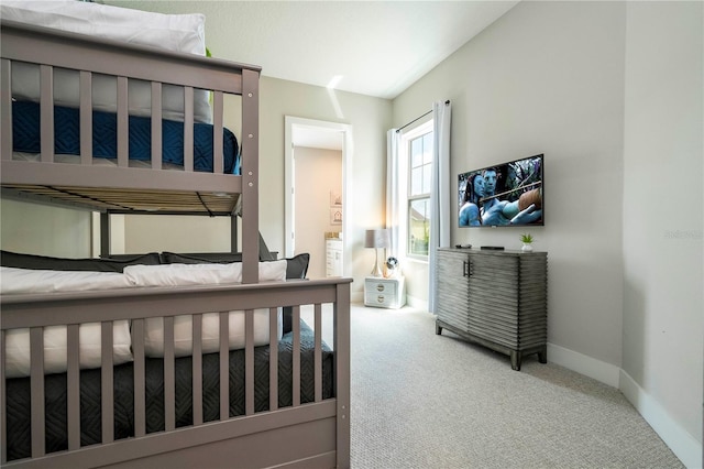 bedroom featuring carpet floors and baseboards