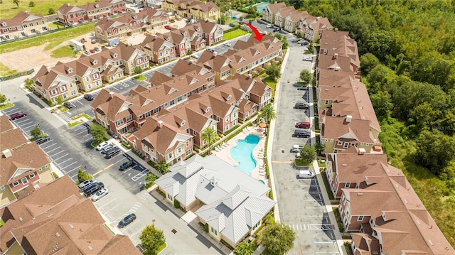aerial view of residential area featuring a pool
