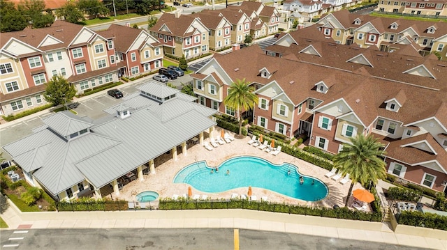 aerial perspective of suburban area featuring a pool area