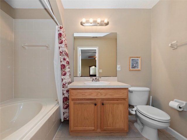 bathroom featuring toilet, tile patterned floors, vanity, shower / bath combination with curtain, and baseboards