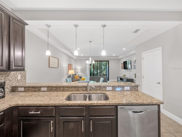 8215 Roseville Blvd, Davenport, FL 33896 - kitchen featuring dishwasher, a sink, dark brown cabinets, light tile patterned floors, and a peninsula