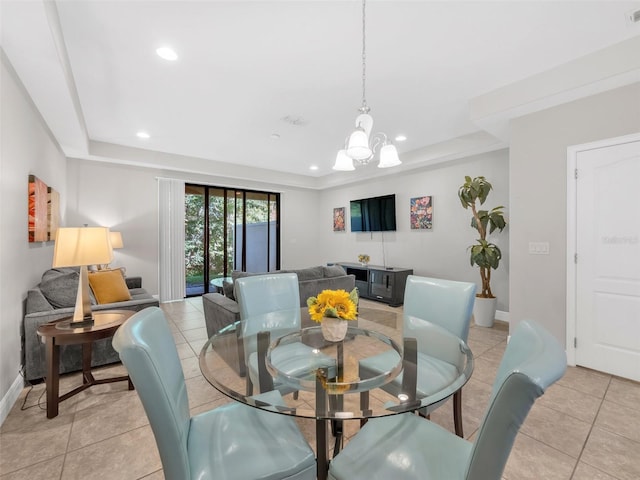 8215 Roseville Blvd, Davenport, FL 33896 - dining space with a raised ceiling, light tile patterned floors, recessed lighting, a chandelier, and baseboards
