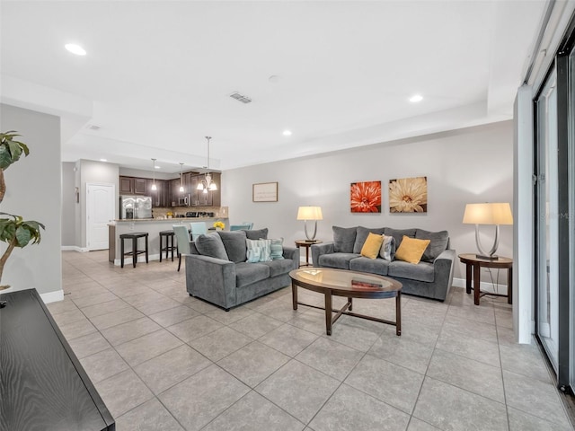8215 Roseville Blvd, Davenport, FL 33896 - living room with light tile patterned flooring, recessed lighting, and baseboards
