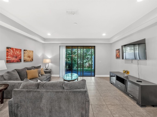 8215 Roseville Blvd, Davenport, FL 33896 - living room with baseboards, light tile patterned flooring, recessed lighting, and a raised ceiling