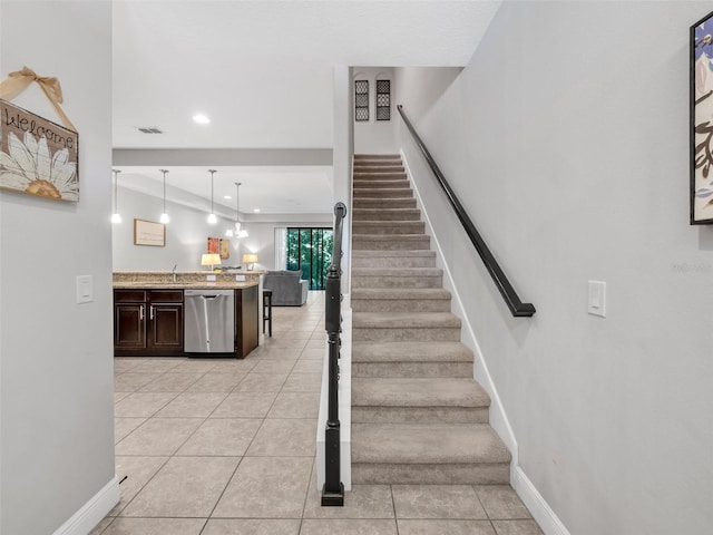 8215 Roseville Blvd, Davenport, FL 33896 - staircase with tile patterned flooring, recessed lighting, and baseboards