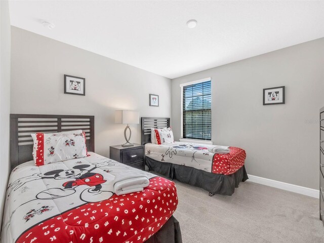 8215 Roseville Blvd, Davenport, FL 33896 - bedroom with carpet flooring and baseboards