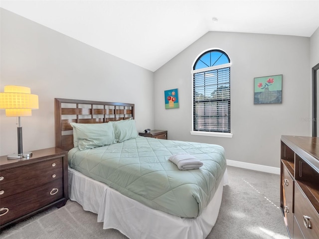 8215 Roseville Blvd, Davenport, FL 33896 - bedroom featuring light carpet, lofted ceiling, and baseboards