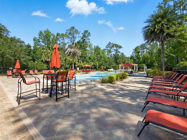 8215 Roseville Blvd, Davenport, FL 33896 - community pool with a patio area and view of scattered trees