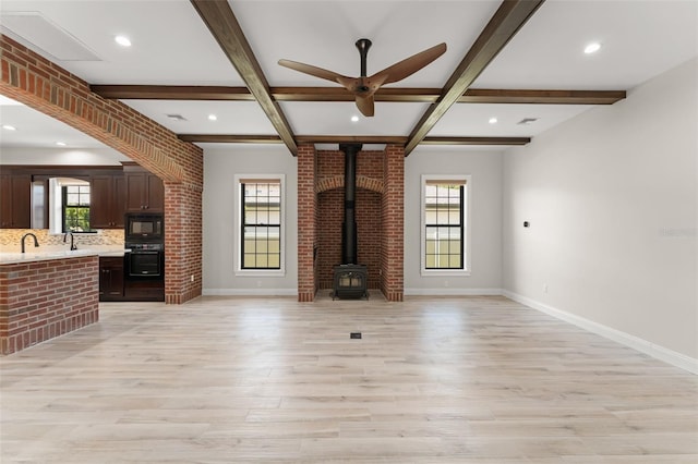 1741 Palmer Ave, Winter Park, FL 32789 - unfurnished living room featuring light wood finished floors, baseboards, ceiling fan, beam ceiling, and recessed lighting
