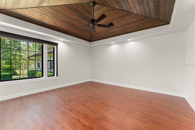 1741 Palmer Ave, Winter Park, FL 32789 - spare room featuring wooden ceiling, a raised ceiling, baseboards, wood finished floors, and a ceiling fan