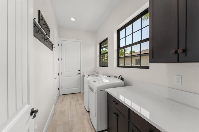 1741 Palmer Ave, Winter Park, FL 32789 - laundry room with cabinet space, washing machine and dryer, light wood-type flooring, recessed lighting, and baseboards