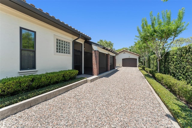 1741 Palmer Ave, Winter Park, FL 32789 - view of side of home with an outdoor structure and stucco siding