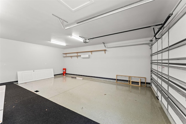 1741 Palmer Ave, Winter Park, FL 32789 - garage featuring a garage door opener, baseboards, and an AC wall unit