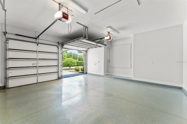 1741 Palmer Ave, Winter Park, FL 32789 - garage featuring a garage door opener and baseboards