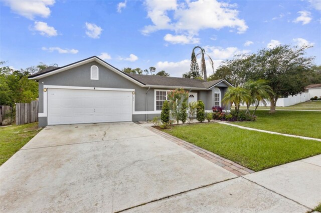 896 Satin Leaf Cir, Ocoee, FL 34761 - ranch-style home featuring stucco siding, a garage, and driveway