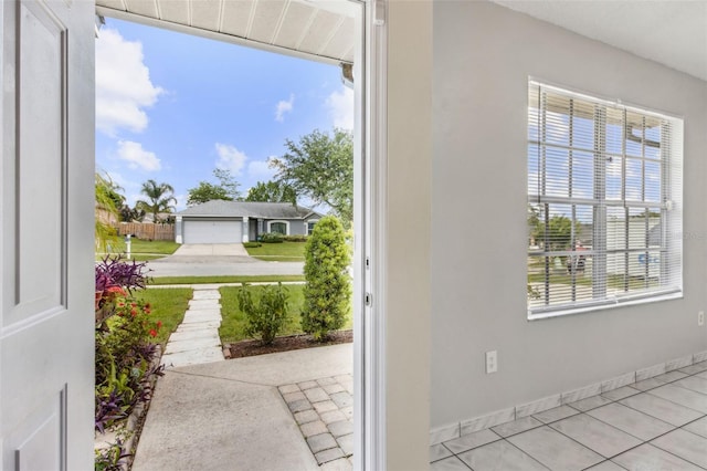 896 Satin Leaf Cir, Ocoee, FL 34761 - doorway with baseboards and tile patterned floors