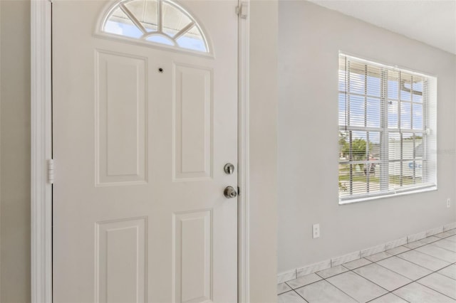 896 Satin Leaf Cir, Ocoee, FL 34761 - entryway with healthy amount of natural light, baseboards, and light tile patterned flooring