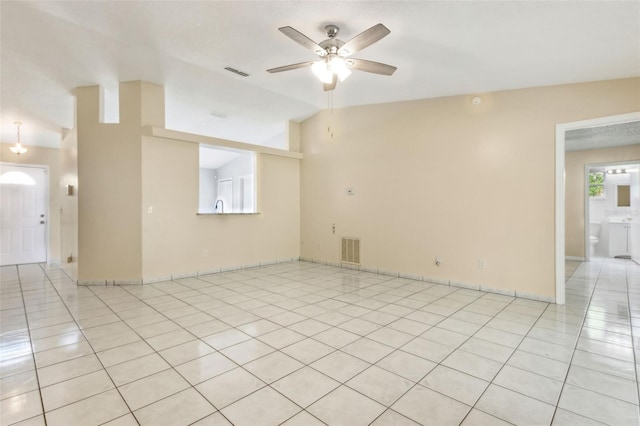 896 Satin Leaf Cir, Ocoee, FL 34761 - spare room with ceiling fan, light tile patterned floors, and vaulted ceiling