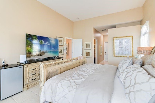 10642 Cloudview Dr, Orlando, FL 32825 - bedroom with refrigerator and light tile patterned floors