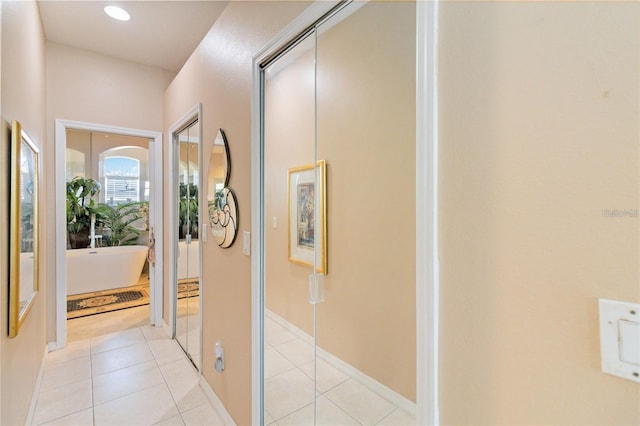 10642 Cloudview Dr, Orlando, FL 32825 - hall with light tile patterned floors and recessed lighting