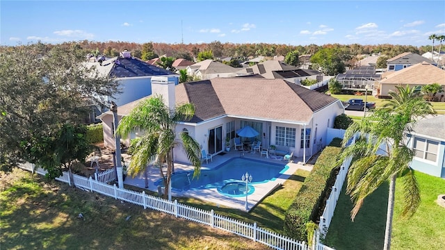 10642 Cloudview Dr, Orlando, FL 32825 - back of house with a residential view, a fenced backyard, stucco siding, and a patio area