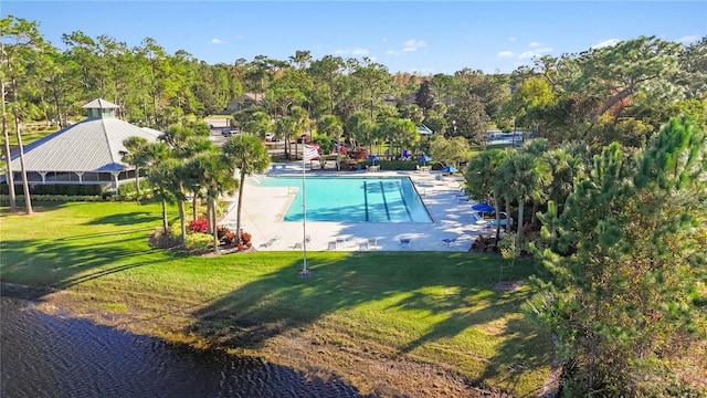 10642 Cloudview Dr, Orlando, FL 32825 - community pool with a lawn, a patio area, and a water view