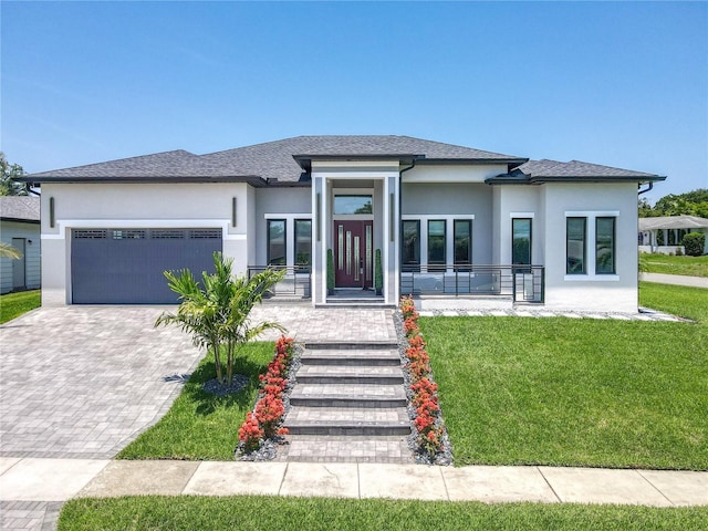 601 Green Briar Blvd, Altamonte Springs, FL 32714 - prairie-style house featuring stucco siding, an attached garage, a front yard, and decorative driveway